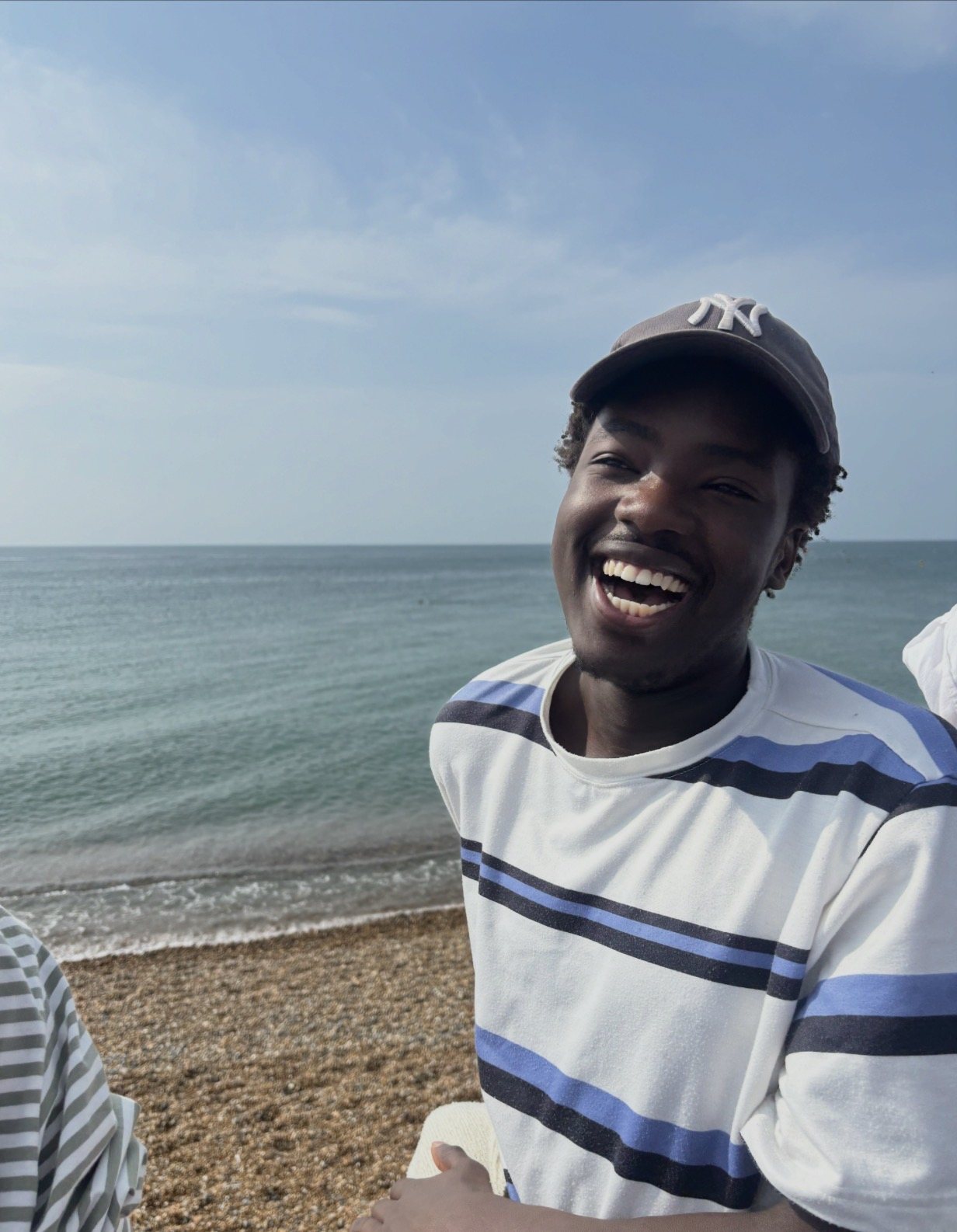 Tende laughing by the sea